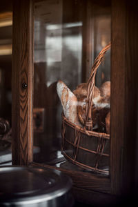 Close-up of horse in basket on table at home