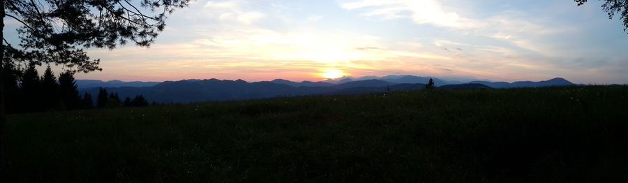 Scenic view of landscape against sky during sunset