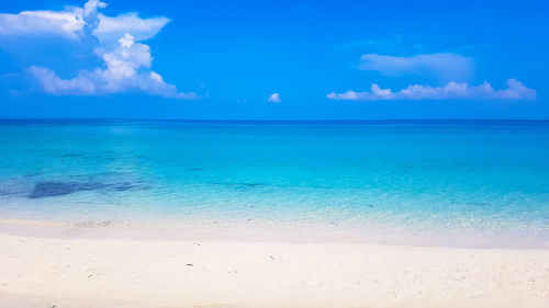Scenic view of sea against blue sky