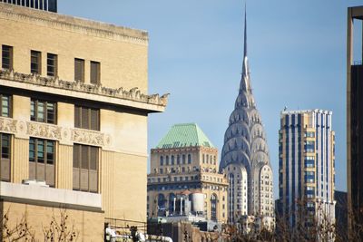 Buildings in city against sky