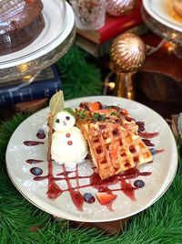 Close-up of cake served in plate on table