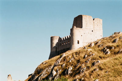 Low angle view of fort against clear sky