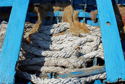 High angle view of rope tied to bollard