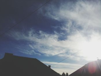 Low angle view of cables against sky