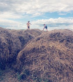 People on land against sky