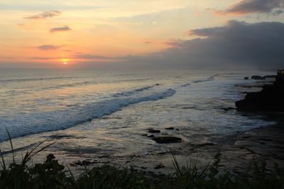 Scenic view of sea against sky during sunset