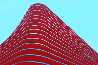 Low angle view of modern building against clear blue sky