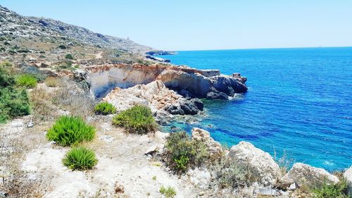 Scenic view of sea against clear blue sky