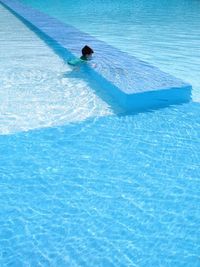 High angle view of person swimming in pool