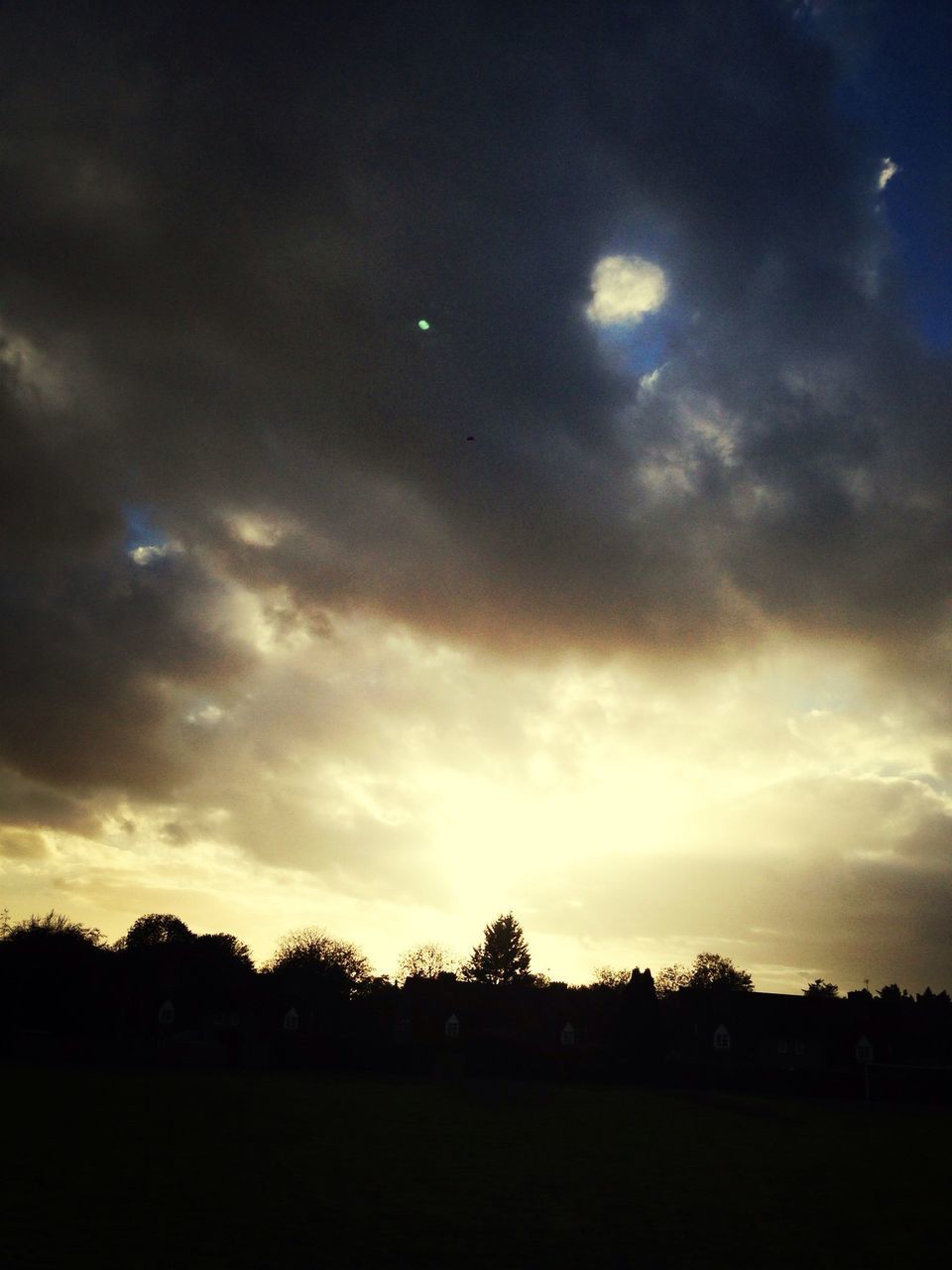 sky, cloud - sky, silhouette, sunset, cloudy, cloud, building exterior, scenics, dusk, nature, weather, tranquility, beauty in nature, tranquil scene, built structure, architecture, tree, outdoors, no people, overcast