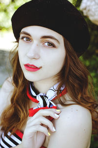 Portrait of young, happy, elegant redhead curly woman, girl in hat, casual clothes. french style.