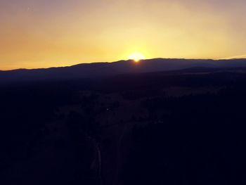 Scenic view of silhouette landscape against sky during sunset