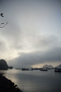 Scenic view of sea against sky at sunset