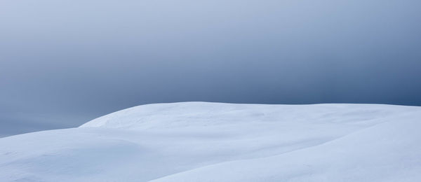 Snow covered mountain against sky