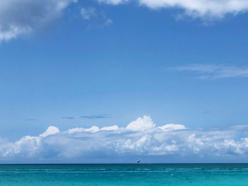 Scenic view of turquoise sea against sky