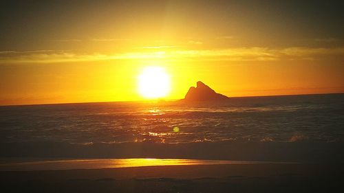 Scenic view of sea at sunset