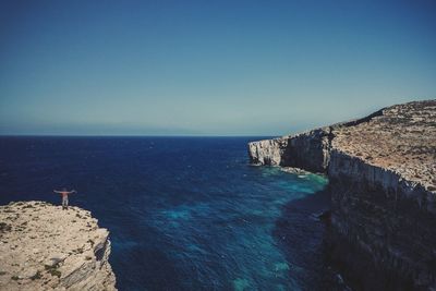 Scenic view of sea against clear blue sky