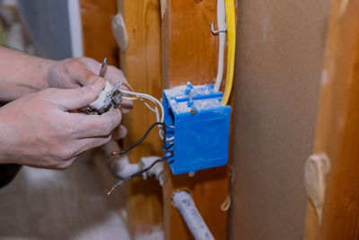 Close-up of man working on metal