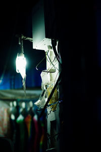 Close-up of illuminated electric lamp at home