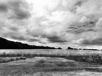 Scenic view of landscape against cloudy sky