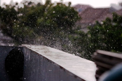 Close-up of wet car window during rainy season