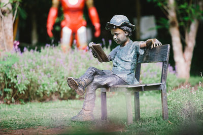 Full length of man sitting on grass