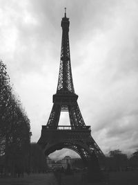 Low angle view of tower against cloudy sky