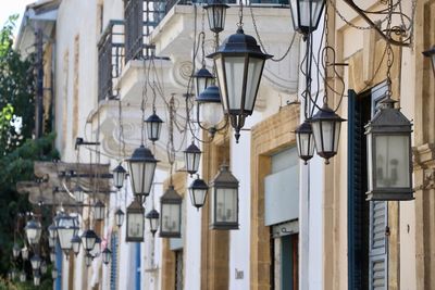 Low angle view of street light against building