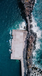 High angle view of swimming pool by sea