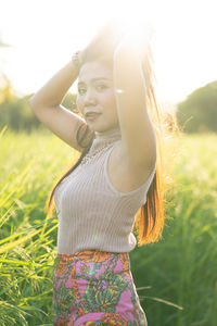 Beautiful woman standing on field
