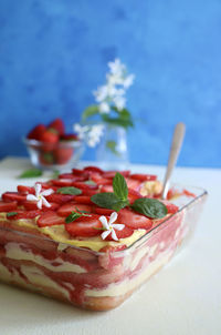 Tiramisu. traditional italian dessert with strawberry and mascarpone. closeup.