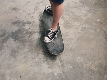 High angle view of person standing on skateboard 