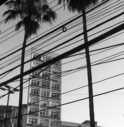 Low angle view of silhouette building against sky