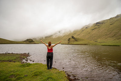 Woman enjoying nature, corvo island, azores, by the lake, wanderlust.