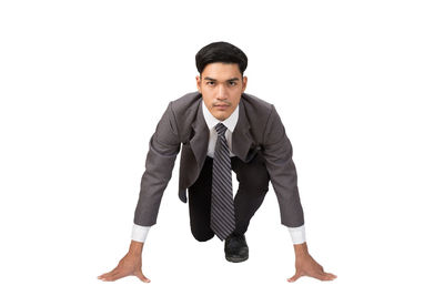 Portrait of young man against white background