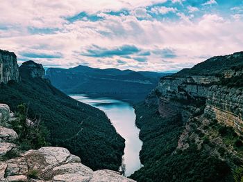 Panoramic view of river and mountains against sky