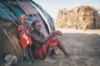 Rear view of people sitting outdoors