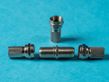 High angle view of objects on table against blue background