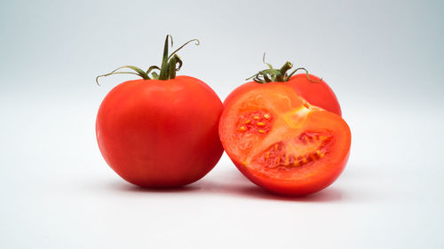 Close-up of tomato against white background