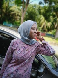 Portrait of woman in car