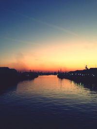 Scenic view of river at sunset