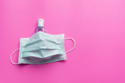 Close-up of pink object on table against gray background