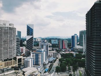 High angle view of buildings in city against sky