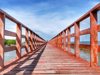 View of bridge against cloudy sky