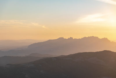 Scenic view of mountains against sky during sunset