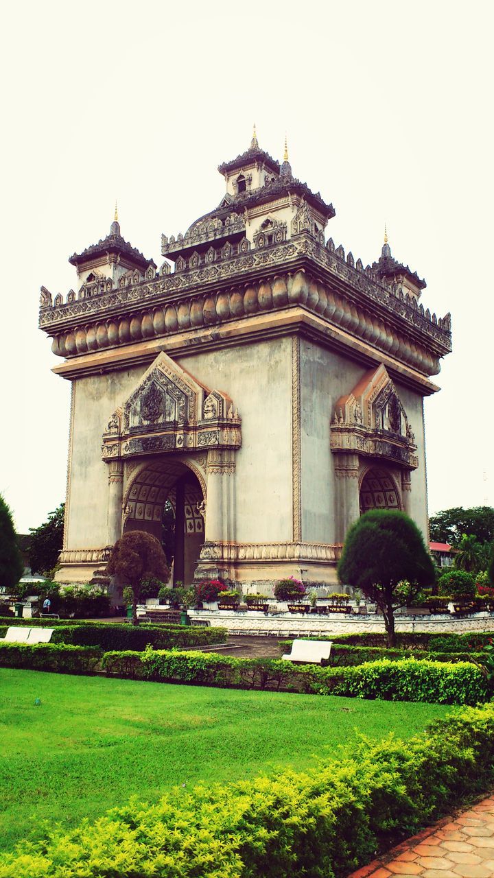 building exterior, architecture, place of worship, built structure, religion, spirituality, grass, clear sky, facade, church, lawn, history, famous place, temple - building, entrance, cathedral, travel destinations, travel