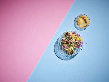 High angle view of pink flower on table