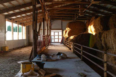 Stack of hay bales in barn