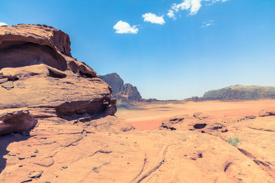 Scenic view of rocky mountains against blue sky