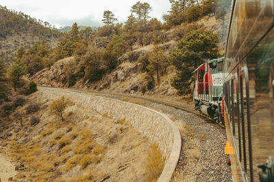 Train on railroad track against sky